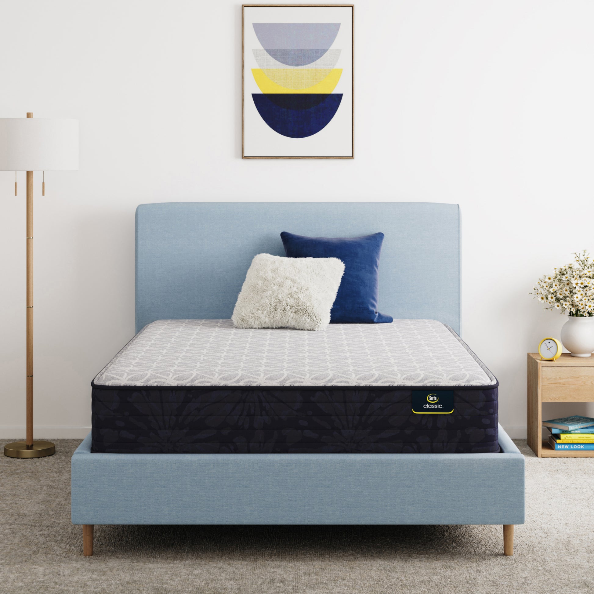 Serta Classic Clarks Hill Mattress on a bed with a blue headboard in a room setting