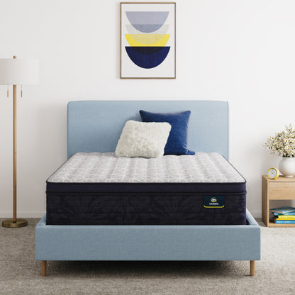 Serta Classic Clarks Hill 14.5" mattress sitting in a blue bed frame with 2 pillows on top of it.
