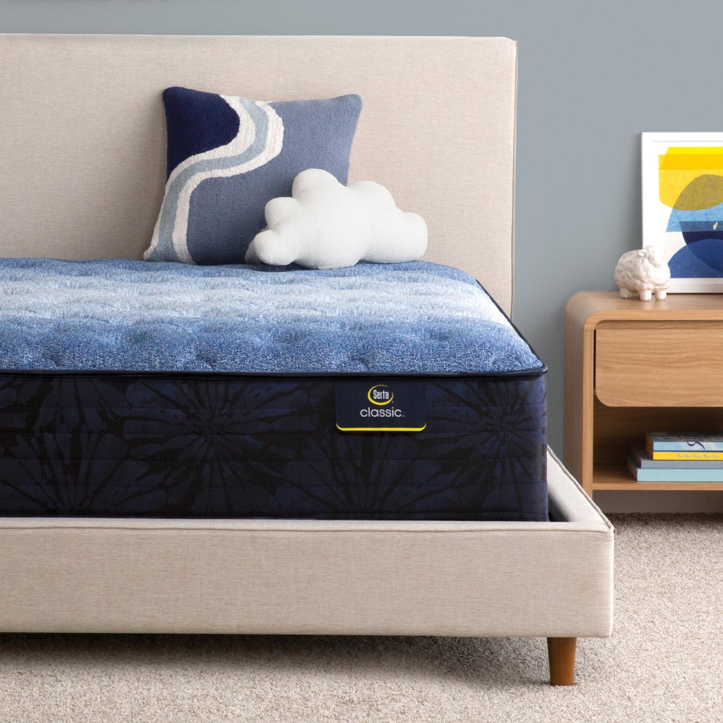 Serta classic brecon medium mattress sitting in a beige bed frame ||feel: medium ||level: enhanced